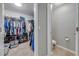 Spacious walk-in closet featuring ample hanging space and shelves for organization at 4740 Cypress Forest Ln, St Cloud, FL 34772