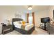 Cozy bedroom with a large bed, side tables, and a TV, perfect for relaxation at 486 Disa Dr, Davenport, FL 33837