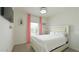 Bright bedroom featuring a plush bed, a window, and a closet at 486 Disa Dr, Davenport, FL 33837