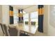 Bright dining room with modern decor, large windows, and comfortable seating for Gathering meals at 486 Disa Dr, Davenport, FL 33837