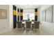Elegant dining area featuring stylish curtains, a modern chandelier, and comfortable seating at 486 Disa Dr, Davenport, FL 33837