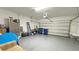 Spacious two-car garage with epoxy floors provides ample space for storage and vehicles at 486 Disa Dr, Davenport, FL 33837