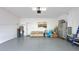 Spacious two-car garage with epoxy floors provides ample space for storage and vehicles at 486 Disa Dr, Davenport, FL 33837