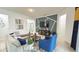 Cozy living room featuring a sleek TV wall, comfortable seating, and an open layout at 486 Disa Dr, Davenport, FL 33837