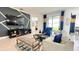 Stylish living room featuring contemporary decor, a plush sofa, and a sliding door to the backyard at 486 Disa Dr, Davenport, FL 33837