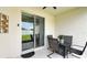 Outdoor patio with a dining set, a sliding glass door, and a view of the backyard at 486 Disa Dr, Davenport, FL 33837