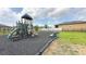 A colorful playground with slides, swings, and climbing structures for Gathering fun at 486 Disa Dr, Davenport, FL 33837