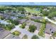 An aerial shot of the home with a backdrop of a golf course and water feature at 514 Cadiz Dr, Davenport, FL 33837