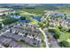 Aerial view of the home showcasing its location near a golf course and scenic ponds at 514 Cadiz Dr, Davenport, FL 33837