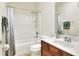 Bathroom featuring a white vanity, combination tub and shower at 514 Cadiz Dr, Davenport, FL 33837
