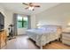 Light-filled bedroom with large window and ceiling fan at 514 Cadiz Dr, Davenport, FL 33837