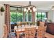 Formal dining room with wooden table and views of lush backyard at 514 Cadiz Dr, Davenport, FL 33837
