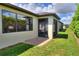 Exterior view of the property highlighting the screened lanai and landscaping at 514 Cadiz Dr, Davenport, FL 33837