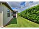 The exterior of the home includes a screened-in porch and beautifully maintained green landscaping at 514 Cadiz Dr, Davenport, FL 33837