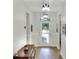 Bright and airy hallway featuring light wood floors, white walls, and modern light fixtures at 514 Cadiz Dr, Davenport, FL 33837