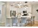 Modern kitchen with stainless appliances, breakfast bar, and pendant lighting at 514 Cadiz Dr, Davenport, FL 33837