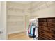 Spacious walk-in closet featuring white wire shelves and dresser at 514 Cadiz Dr, Davenport, FL 33837