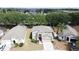 Aerial view of a two-story home featuring manicured landscaping and a paver driveway at 532 Kildrummy Dr, Davenport, FL 33896