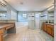 Bright bathroom featuring a soaking tub, a walk-in shower, and dual sinks at 532 Kildrummy Dr, Davenport, FL 33896