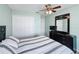 Bedroom featuring a dresser with mirror, closet and ceiling fan with light at 532 Kildrummy Dr, Davenport, FL 33896