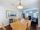 Bright dining room featuring wood floors, arched doorway, and plenty of natural light at 532 Kildrummy Dr, Davenport, FL 33896