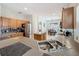 Bright kitchen with stainless steel appliances, granite countertops, an island, and tile flooring at 532 Kildrummy Dr, Davenport, FL 33896