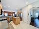 Spacious kitchen with stainless steel appliances, granite countertops, and an open layout to the living room at 532 Kildrummy Dr, Davenport, FL 33896