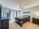 Main bedroom has carpeted floor, balcony, ceiling fan and great natural light at 532 Kildrummy Dr, Davenport, FL 33896