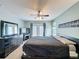 Main bedroom boasts a ceiling fan, balcony access, and a spacious layout at 532 Kildrummy Dr, Davenport, FL 33896