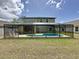 A screened-in in-ground pool offers outdoor relaxation at this inviting two-story home at 532 Kildrummy Dr, Davenport, FL 33896