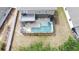 Aerial view of a screened-in pool area with an adjacent patio deck at 532 Kildrummy Dr, Davenport, FL 33896