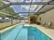 Relaxing screened-in pool with plenty of patio space for lounge chairs and entertaining in a private backyard at 532 Kildrummy Dr, Davenport, FL 33896