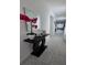 Stylish hallway featuring a decorative table, a mirror, and ceramic tile flooring at 5539 Maddie Dr, Haines City, FL 33844