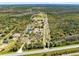 Expansive aerial shot outlines property lines, highlighting home, green space and natural surroundings, accessible via long driveway at 5801 N Kenansville Rd, St Cloud, FL 34773