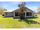 Rear exterior of the house with a screened patio at 5801 N Kenansville Rd, St Cloud, FL 34773