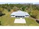 Stunning ranch-style home featuring a metal roof, well-manicured lawn, and a spacious front porch at 5801 N Kenansville Rd, St Cloud, FL 34773