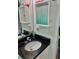 Bathroom features granite countertop and cabinet with a vanity at 731 Wyman Ct # 731-A, Orlando, FL 32809