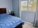 This bedroom has a neutral color and nice window for natural light to create a relaxing atmosphere at 731 Wyman Ct # 731-A, Orlando, FL 32809
