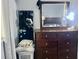 Bedroom with a mirror, dresser, and shoe organizer, combining comfort and functionality at 731 Wyman Ct # 731-A, Orlando, FL 32809