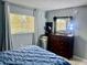 A well-lit bedroom featuring a dresser, providing ample storage space, paired with a window at 731 Wyman Ct # 731-A, Orlando, FL 32809