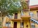 Two-story condo featuring a balcony and outdoor staircase at 731 Wyman Ct # 731-A, Orlando, FL 32809