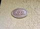 Close-up of an apartment number plaque with the unit number 