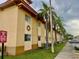 A condo with palm trees along the walkway and exterior design elements at 731 Wyman Ct # 731-A, Orlando, FL 32809
