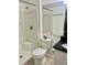 Bright bathroom featuring a shower with a stylish black countertop and a decorative pink flower accent at 731 Wyman Ct # 731-A, Orlando, FL 32809