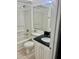 Clean bathroom featuring a shower-tub combo, tiled floor, a toilet, and a modern vanity with a black countertop at 731 Wyman Ct # 731-A, Orlando, FL 32809