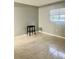 A bright bedroom features a window, tile flooring, and neutral walls, offering a simple living space at 731 Wyman Ct # 731-A, Orlando, FL 32809