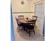A cozy dining room featuring a wood table and four chairs at 731 Wyman Ct # 731-A, Orlando, FL 32809