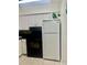 Kitchen with white cabinets, black countertops and appliances at 731 Wyman Ct # 731-A, Orlando, FL 32809
