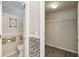 Bathroom with tiled shower and walk-in closet at 784 Seneca Trl, St Cloud, FL 34772