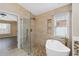 Spa bathroom features frameless shower and soaking tub at 784 Seneca Trl, St Cloud, FL 34772
